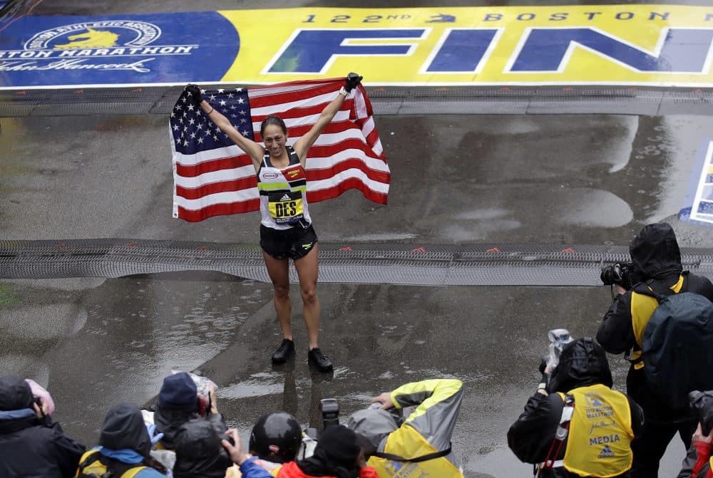 Desiree Linden, of Michigan, celebrates after winning the women's division of the 122nd Boston Marathon. She is the first American woman to win the race since 1985. (Charles Krupa/AP)