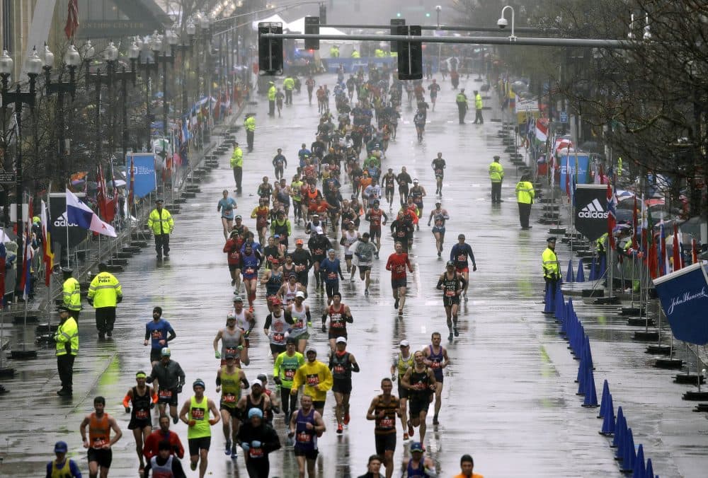 Runners approach the finish line. (Charles Krupa/AP)