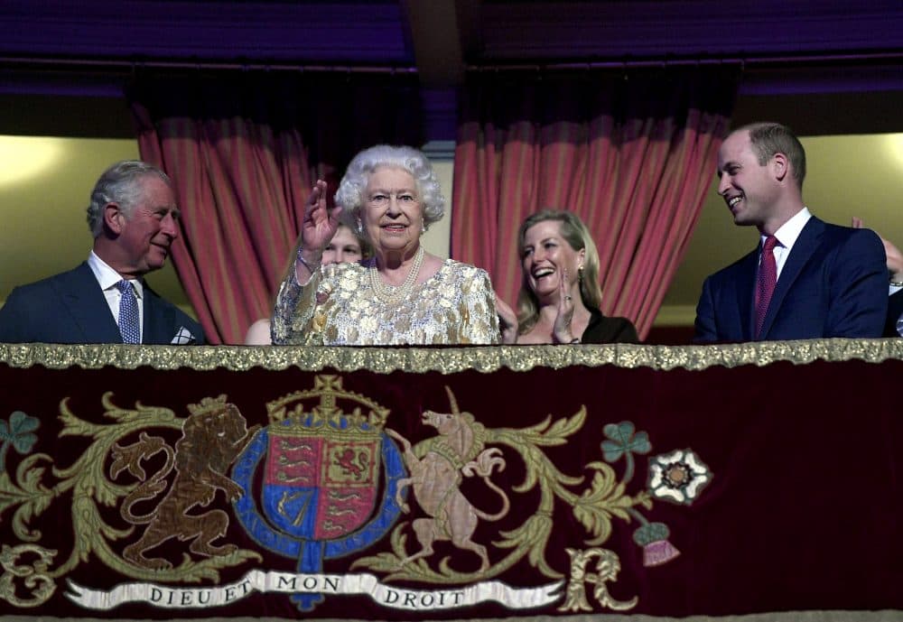 Queen Elizabeth II surrounded by members of the royal family waves to the crowd at the Royal Albert Hall in London on Saturday April 21, 2018, for a concert to celebrate the Queen's 92nd birthday. (Andrew Parsons/Pool via AP)