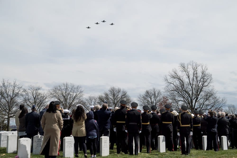 Members of Hudner's former squadron fly in a missing man formation over Hudner's graveside ceremony. (Eslah Attar/NPR)