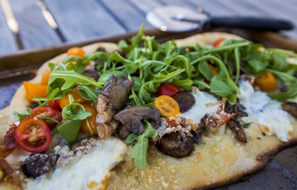 Kathy's mushroom, prosciutto, mozzarella and arugula pizza. (Jesse Costa/WBUR)