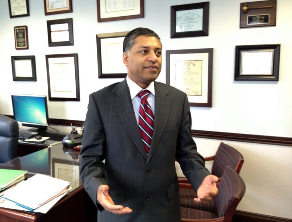 Dr. Rahul Gupta, state health officer of West Virginia, talks in his office in Charleston, W.Va., in 2015. (John Raby/AP)