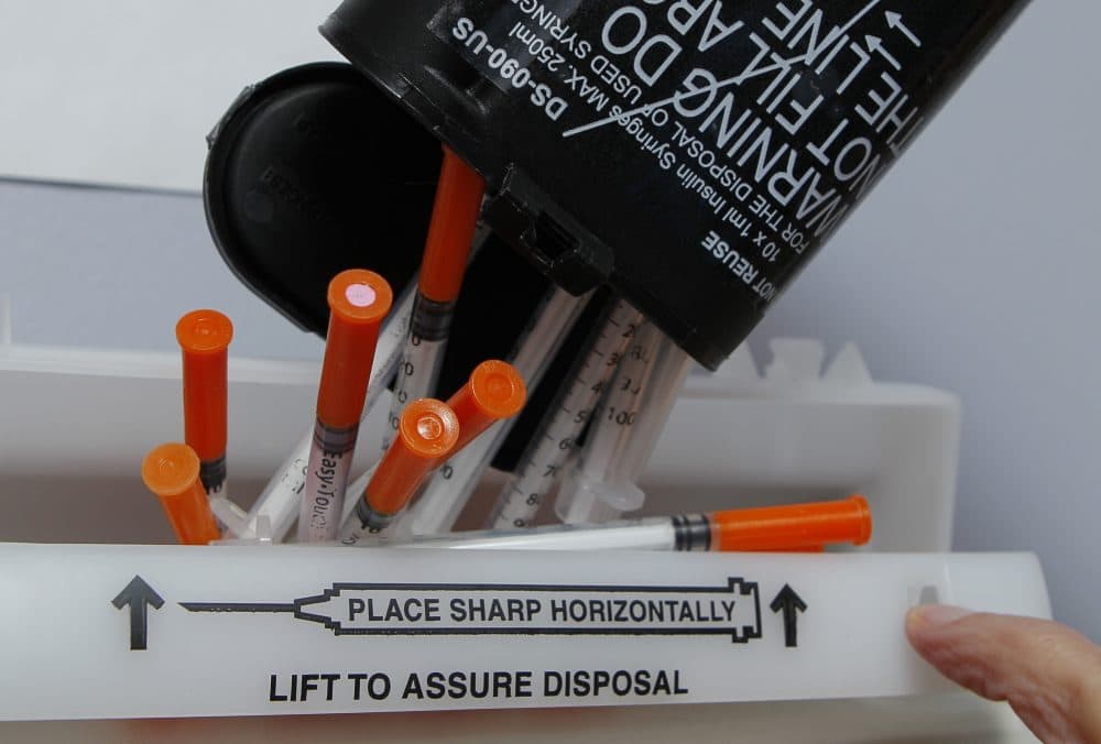 Hypodermic needles are disposed of at a clinic, Friday, Jan. 20, 2012. (Robert F. Bukaty/AP)