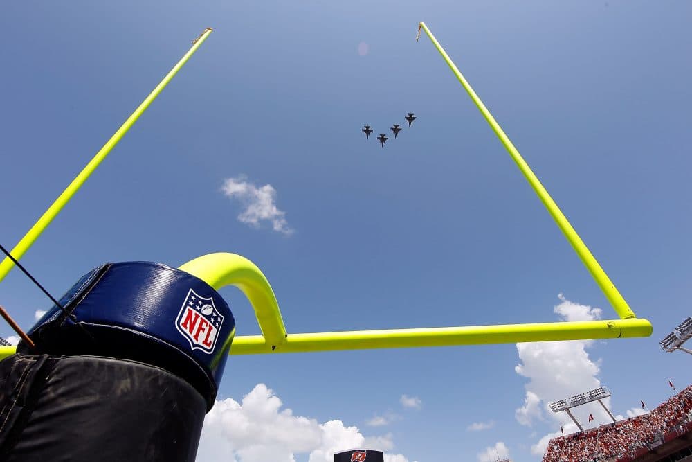 &quot;They were all in on it: NASCAR, MLB, the NBA, the NFL, NHL, MLS, and the NCAA. The military was using sports to sell the business of war,&quot; Howard Bryant writes. Pictured: Fighter jets fly over Raymond James Stadium just prior to the start of the game between the Tampa Bay Buccaneers and the Cleveland Browns. (J. Meric/Getty Images)