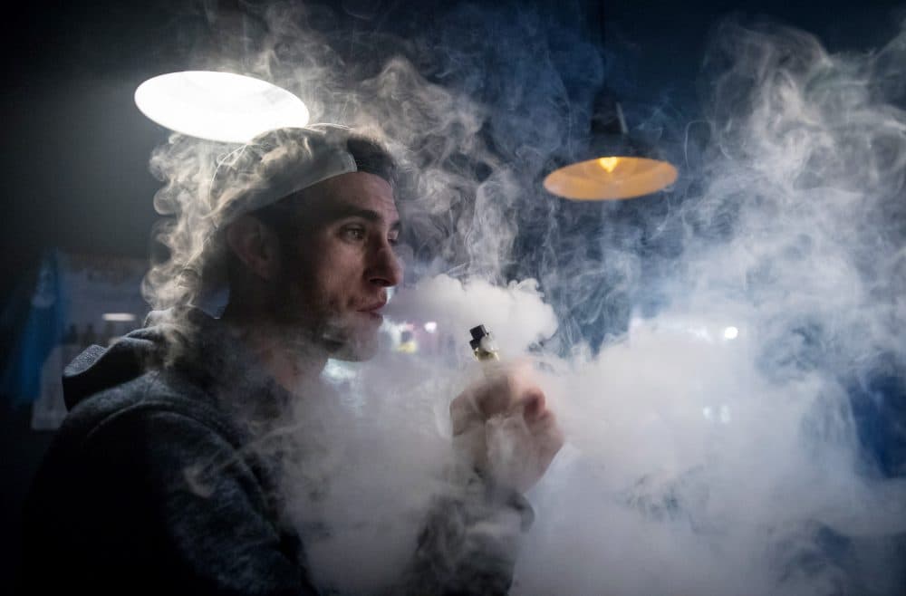 A man exhales vapor produced by an e-cigarette in Bristol, England. (Matt Cardy/Getty Images)