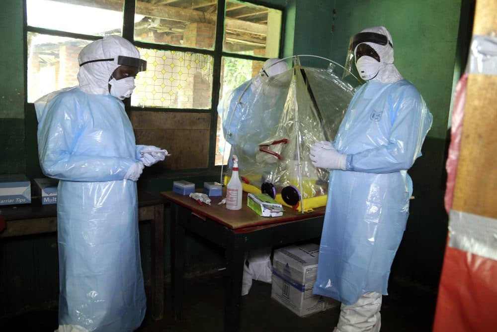 In this photo taken on Sunday, May 13, 2018, health care workers wear virus protective gear at a treatment center in Bikoro Democratic Republic of Congo. Congo's latest Ebola outbreak has spread to a city of more than 1 million people, a worrying shift as the deadly virus risks traveling more easily in densely populated areas. (John Bompengo/AP)