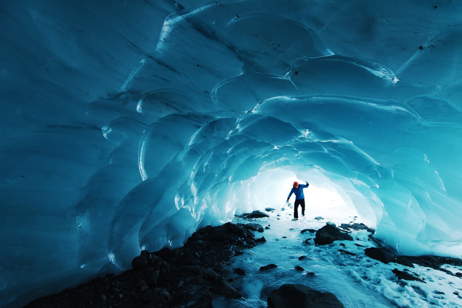 Skating in a small ice cave below Byron Glacier, in the Chugach National Forest of Alaska. (Paxson Woebler/Unsplash)