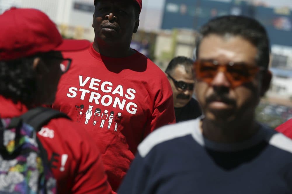 Culinary Union members exit a university arena after voting on whether to authorize a strike Tuesday, May 22, 2018, in Las Vegas. (Isaac Brekken/AP)