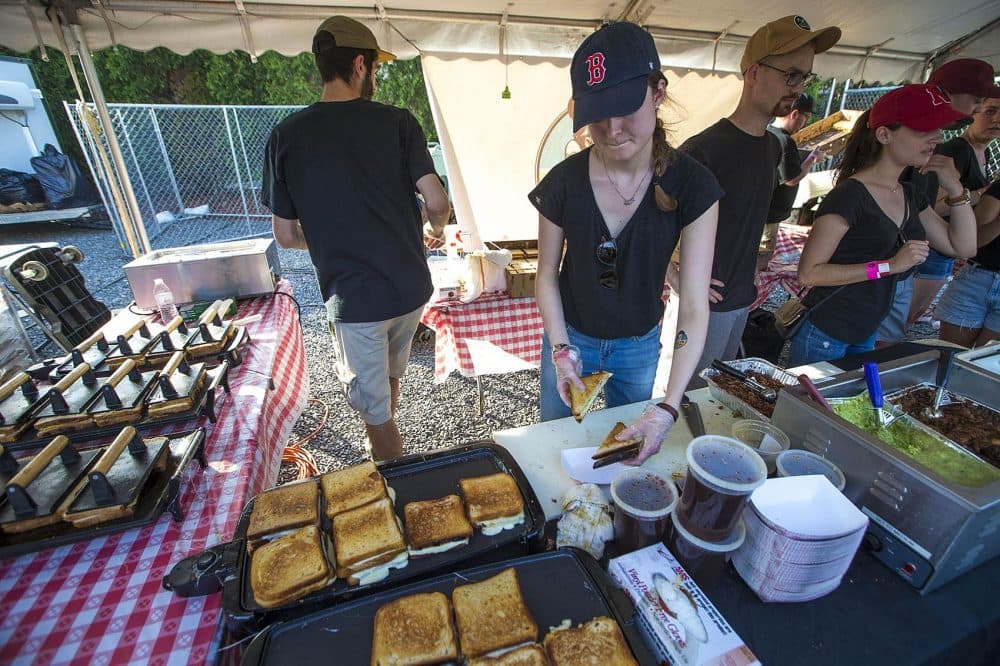 The production line at one of the Roxy's Grilled Cheese booths at Boston Calling. (Jesse Costa/WBUR)