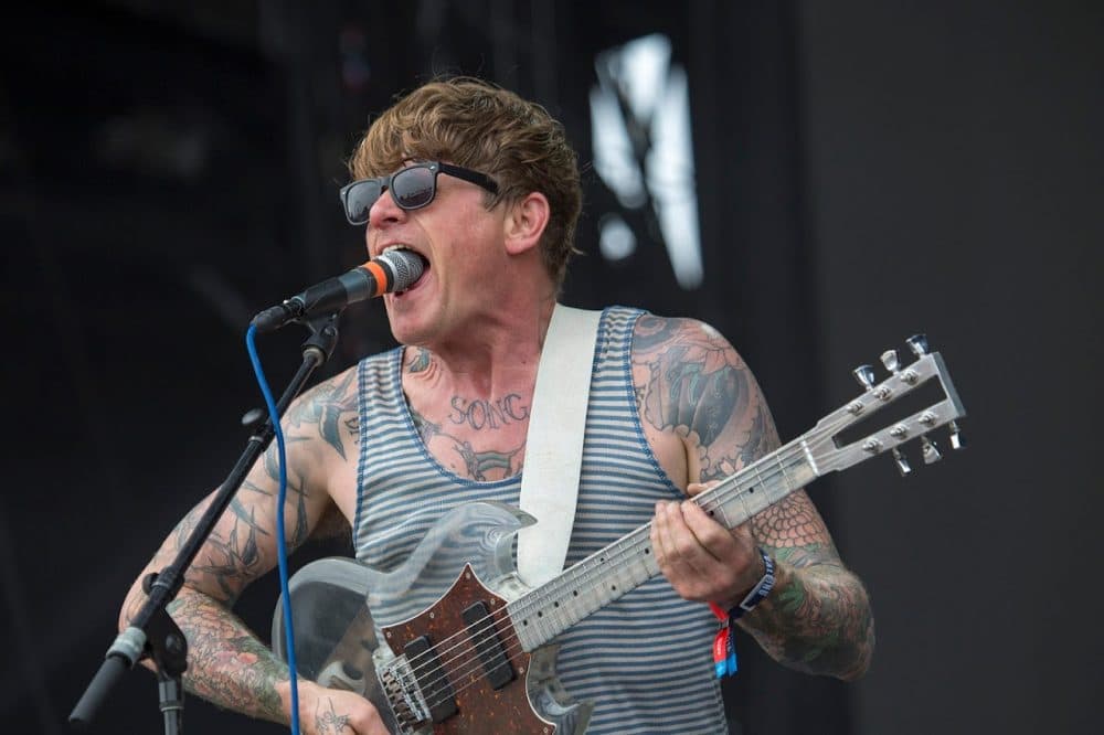 John Dwyer of Thee Oh Sees swallows the microphone during his set. (Jesse Costa/WBUR)