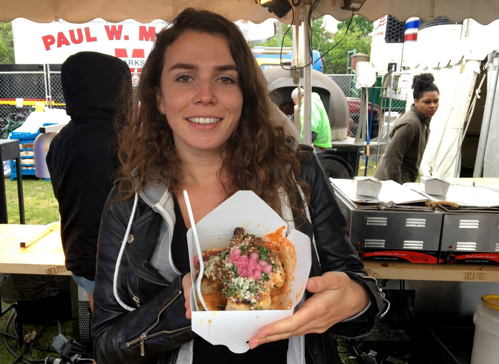 Nicole Baker holding Supreme BBQ Pork Knots from Area Four. (Andrea Shea/WBUR)