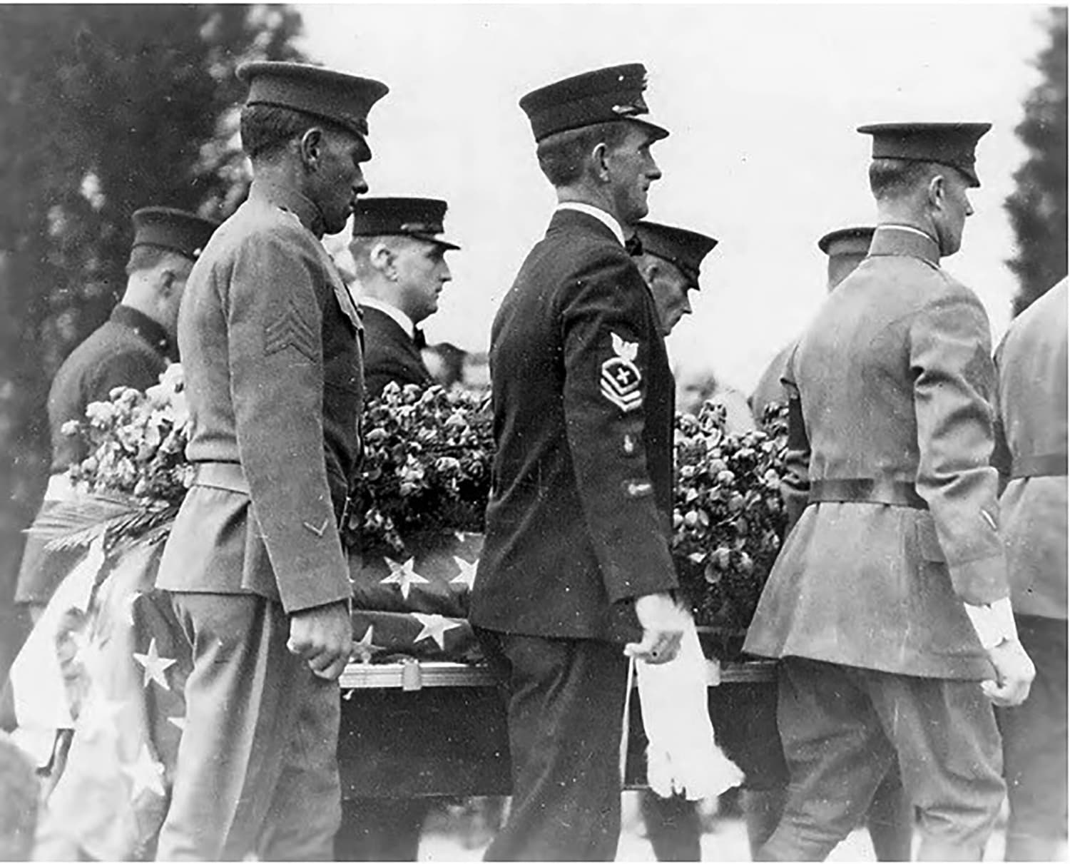 The eight body bearers carry the unknown soldier's casket during the burial ceremony at Arlington National Cemetery on Nov. 11, 1921. (Courtesy)