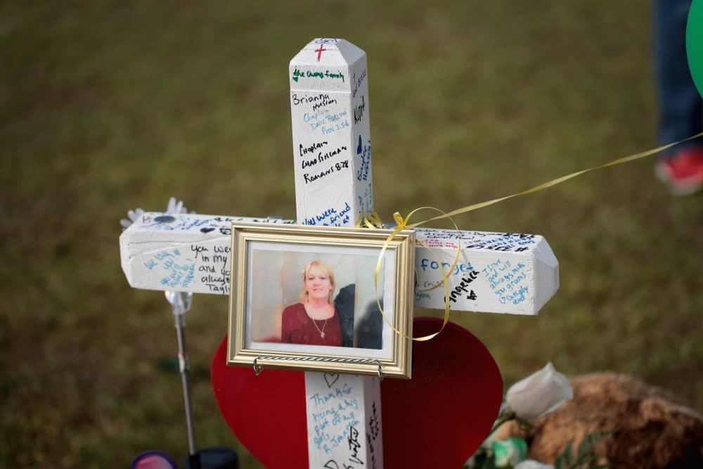 A photo of Cynthia Tisdale hangs on a cross at a memorial in front of Santa Fe High School on May 22, 2018 in Santa Fe, Texas. (Scott Olson/Getty Images)