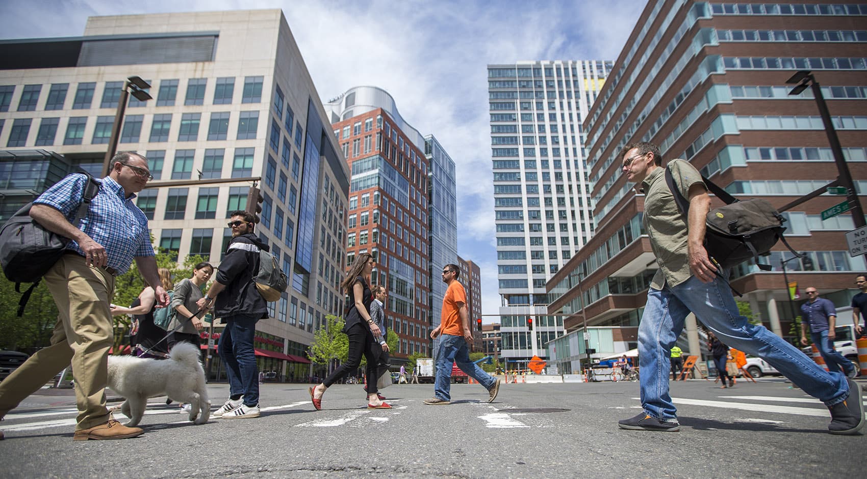 People cross at the intersection of Ames and Main streets. Kendall Square is home to dozens of biotech companies. (Jesse Costa/WBUR)