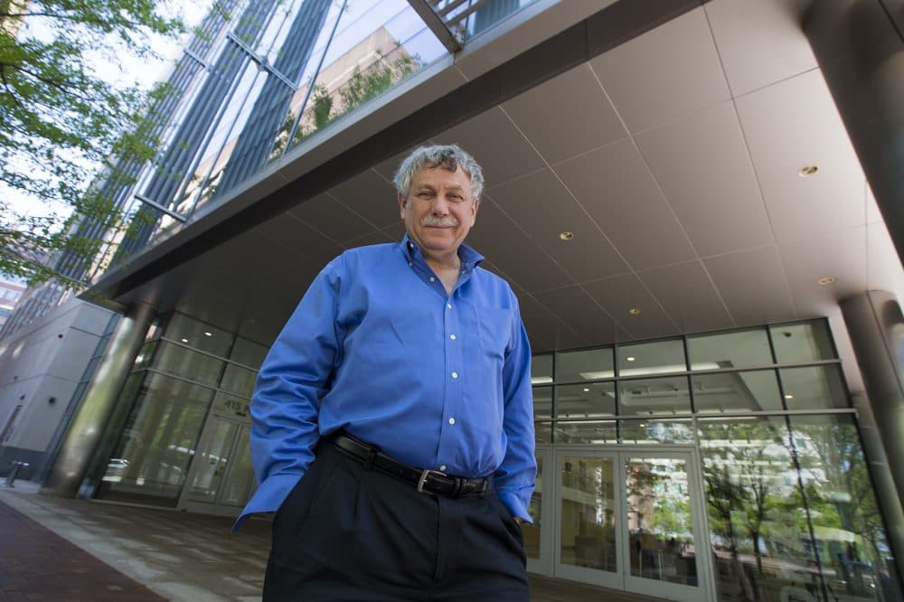 Geneticist Eric Lander stands outside of the Broad Institute in Kendall Square. (Jesse Costa/WBUR)