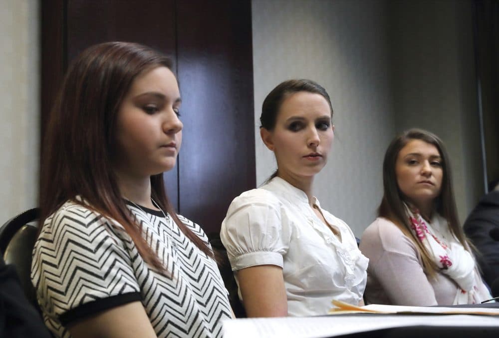 In this photo, Kaylee Lorincz, from left, Rachael Denhollander and Lindsey Lemke, all victims of Dr. Larry Nassar speak after a plea hearing in Lansing, Mich., Wednesday, Nov. 22, 2017. Michigan State University has reached a $500 million settlement with hundreds of women and girls who say they were sexually assaulted by Nassar in the worst sex-abuse case in sports history. The deal was announced Wednesday, May 16, 2018, by Michigan State and lawyers for 332 victims. (Paul Sancya/AP)