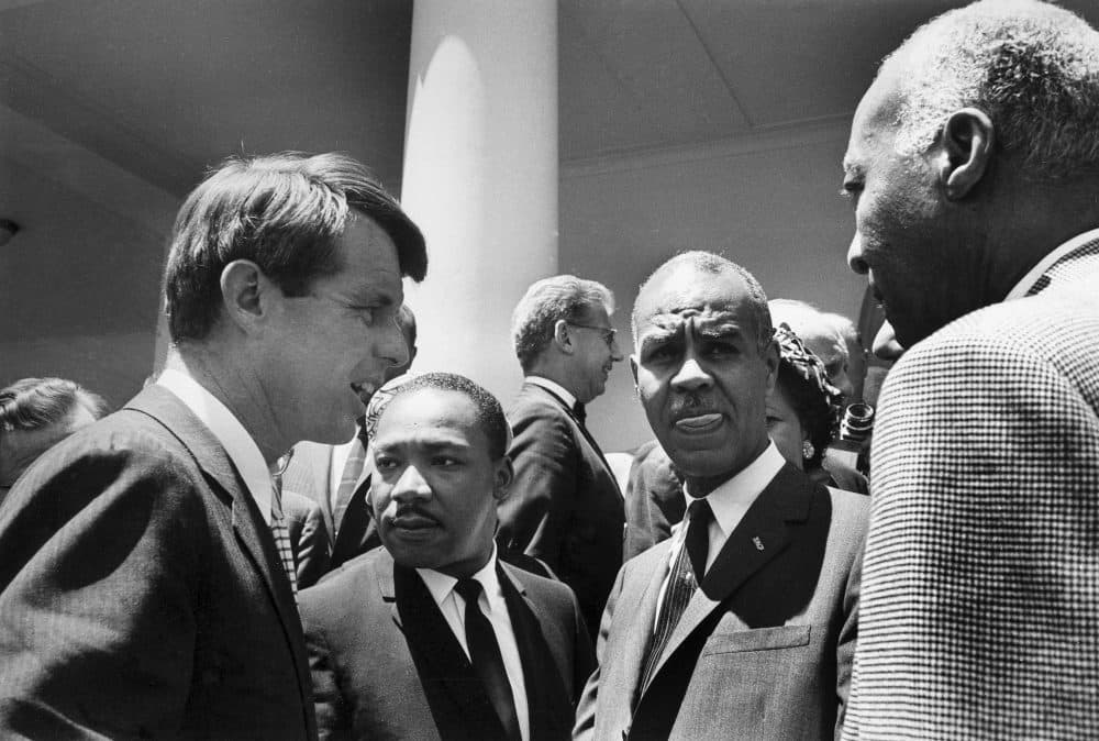 In this June 22, 1963, file photo, U.S. Attorney General Robert F. Kennedy, left, speaks with civil rights leaders, beginning second from left, Rev. Martin Luther King, Jr., head of the Southern Christian Leadership Conference; Roy Wilkins, executive secretary of the NAACP; and A. Phillip Randolph, president of Brotherhood of Sleeping Car Porters, on the White House grounds, in Washington, DC. (Bob Schutz/AP)