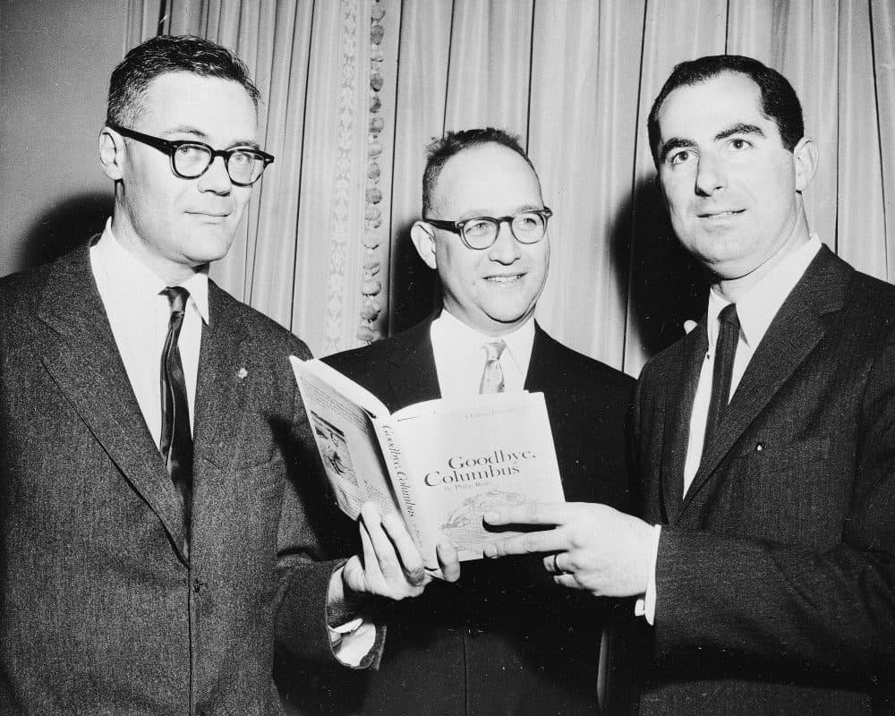 In this March 24, 1960 file photo, the three winners of the National Book Award, Robert Lowell, from left, awarded for the most distinguished book of poetry, Richard Ellmann, won in the nonfiction category, and Philip Roth, received the award in the fiction category for his book "Goodbye, Columbus," pose at the Astor Hotel in New York City. (AP)