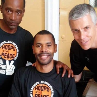 Former US Secretary of Education Arne Duncan (right) joined former All-City hooper Jimmy Sanders (left) and Shawn Harrington at a recent Hoops for Peace event in Chicago. (Mike James) 