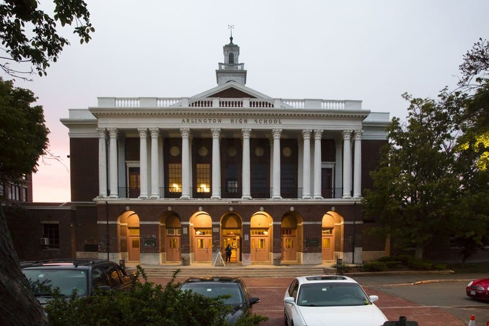 After graffiti with anti-gay and anti-Semitic messages were found at Arlington High School, students wrote messages of inclusion in chalk on the building's front brick archways. (Jess Voas for WBUR)