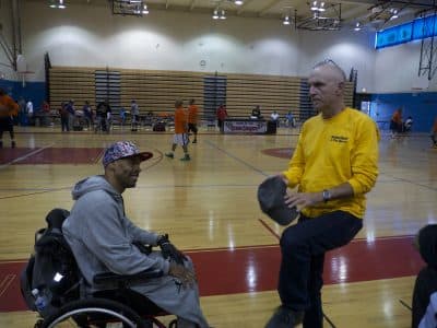 Harrington and Bradburd talk after a game Shawn organized to promote peace in Chicago. (Michael James)