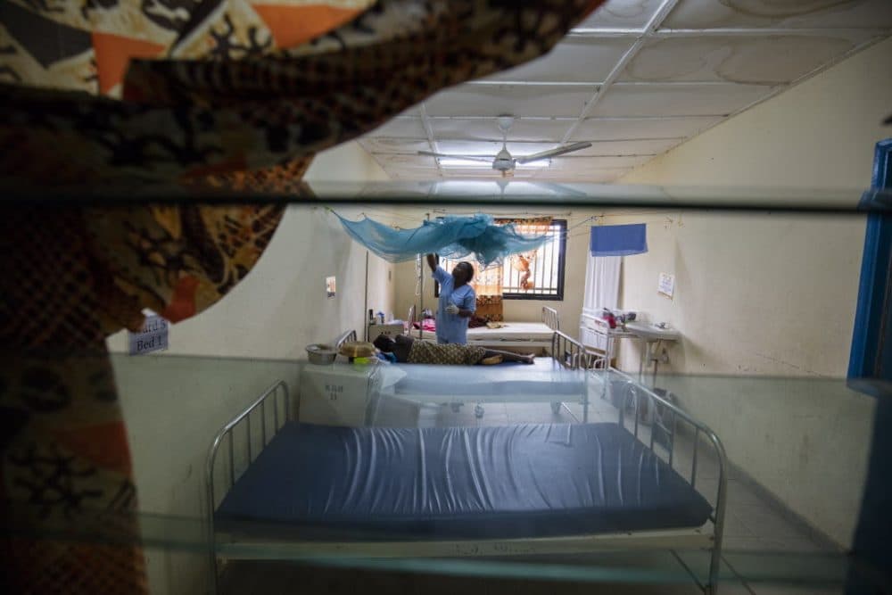 Nurse Mariama Gbangba cares for women in the maternity ward of the Koidu Government Hospital in Kono, Sierra Leone, on May 27, 2016. Each woman is encouraged to sleep under the provided bed net to prevent malaria. (Partners In Health)