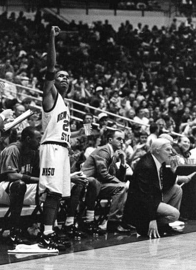 Shawn Harrington salutes the crowd. Assistant Coach Rus Bradburd (middle) looks on. (NMSU/Dennis Daily)