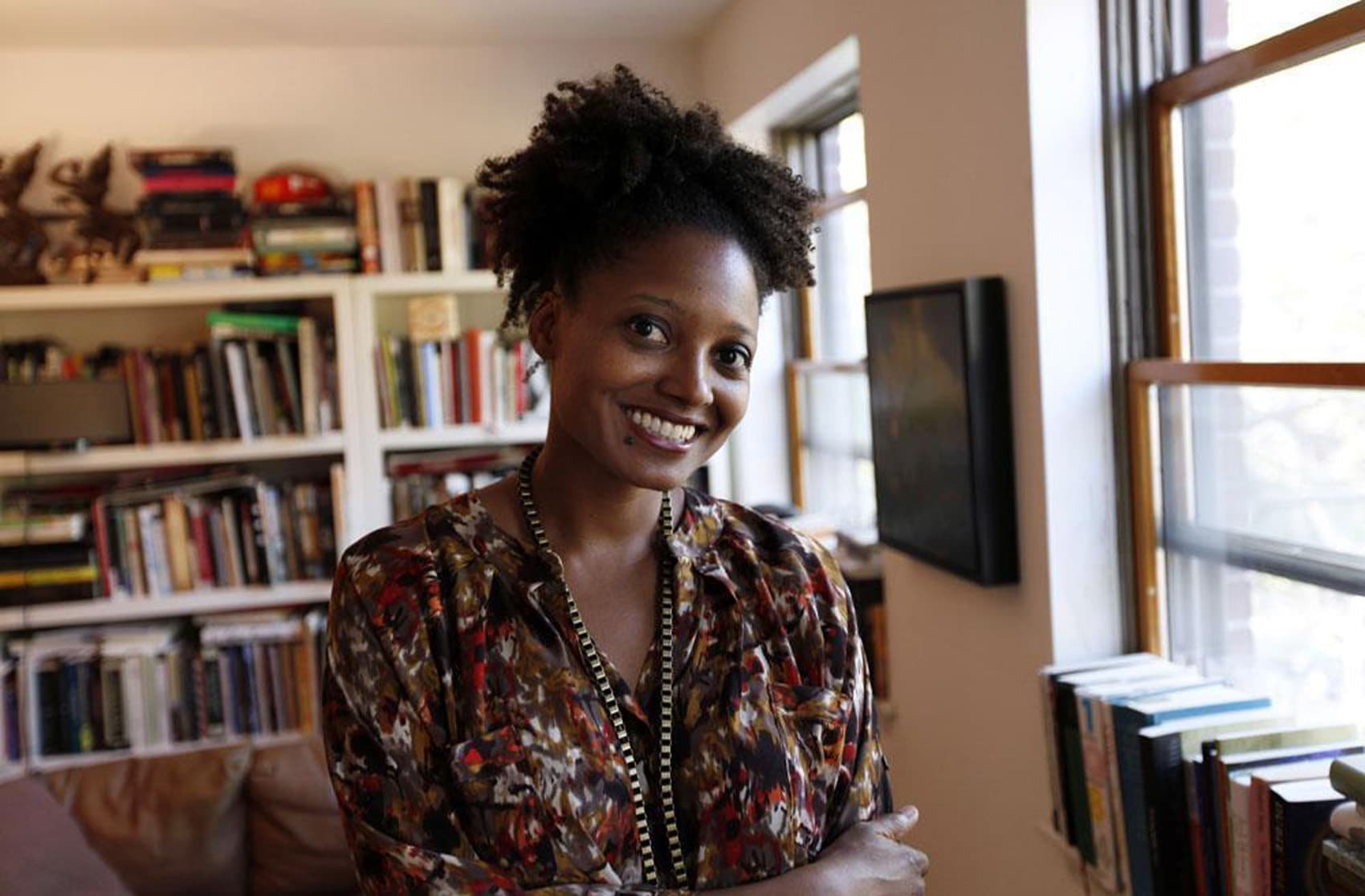 Tracy K. Smith poses in her Brooklyn apartment after winning the Pulitzer Prize for poetry her poetry collection "Life on Mars," in April, 2012 in New York. (AP/Jason DeCrow)