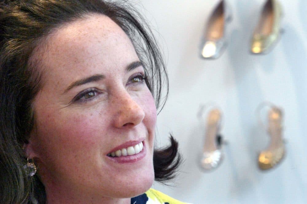 In this May 13, 2004 file photo, designer Kate Spade poses with shoes from her next collection in New York. Law enforcement officials say Tuesday, June 5, 2018, that New York fashion designer Kate Spade has been found dead in her apartment in an apparent suicide. (Bebeto Matthews/AP)