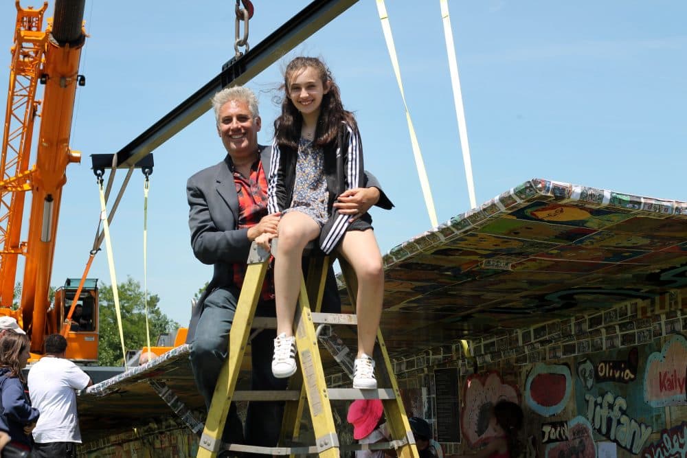 Jerry Beck and his daughter Georgie in front of Project Soar. (Amy Gorel/WBUR)