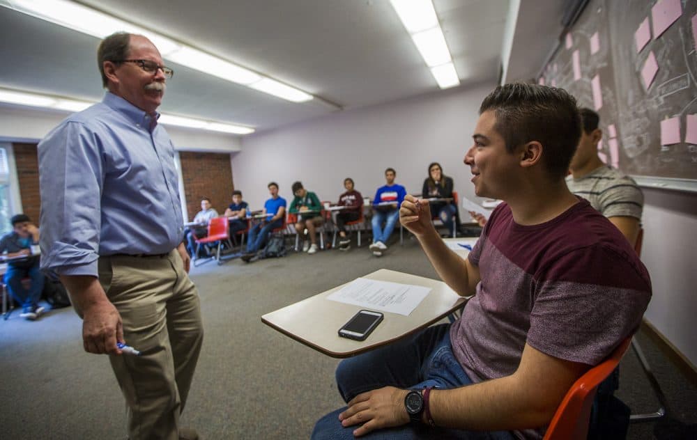 Bill Vogele conducts an International Development Class at Pine Manor College with students visiting from prep schools run by Tecnologico de Monterrrey in Mexico. (Jesse Costa/WBUR)