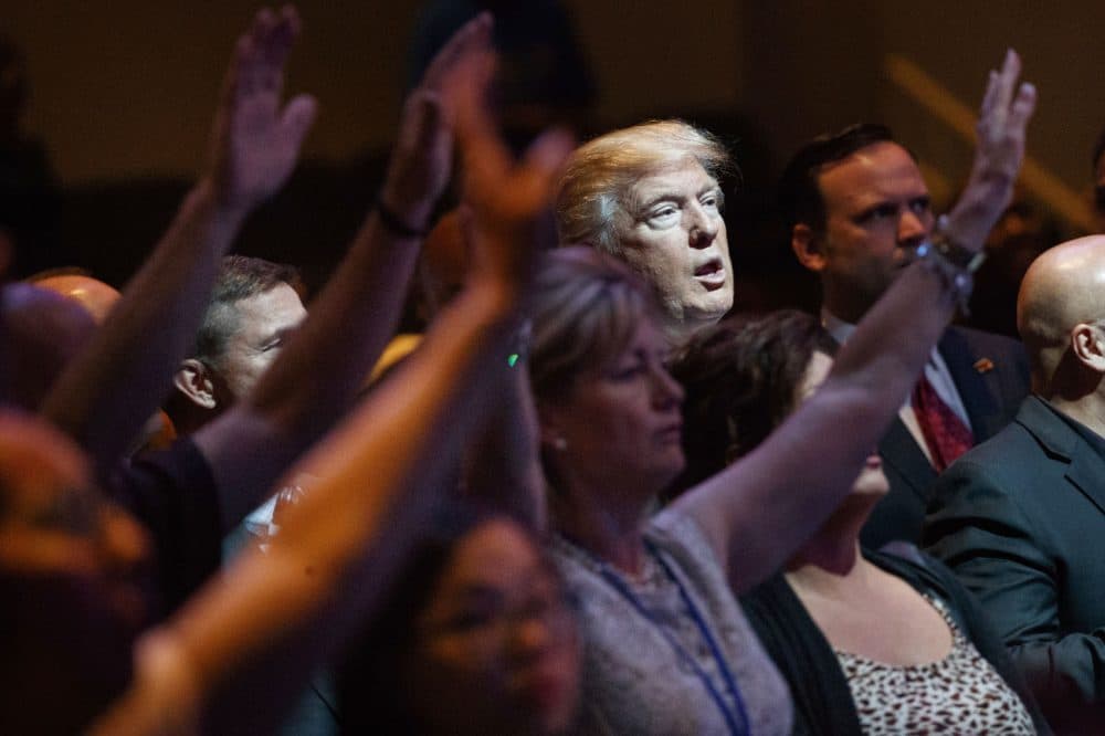 In this Oct. 30, 2016, file photo, then-Republican presidential candidate Donald Trump stands during a service at the International Church of Las Vegas in Las Vegas. (Evan Vucci/AP)