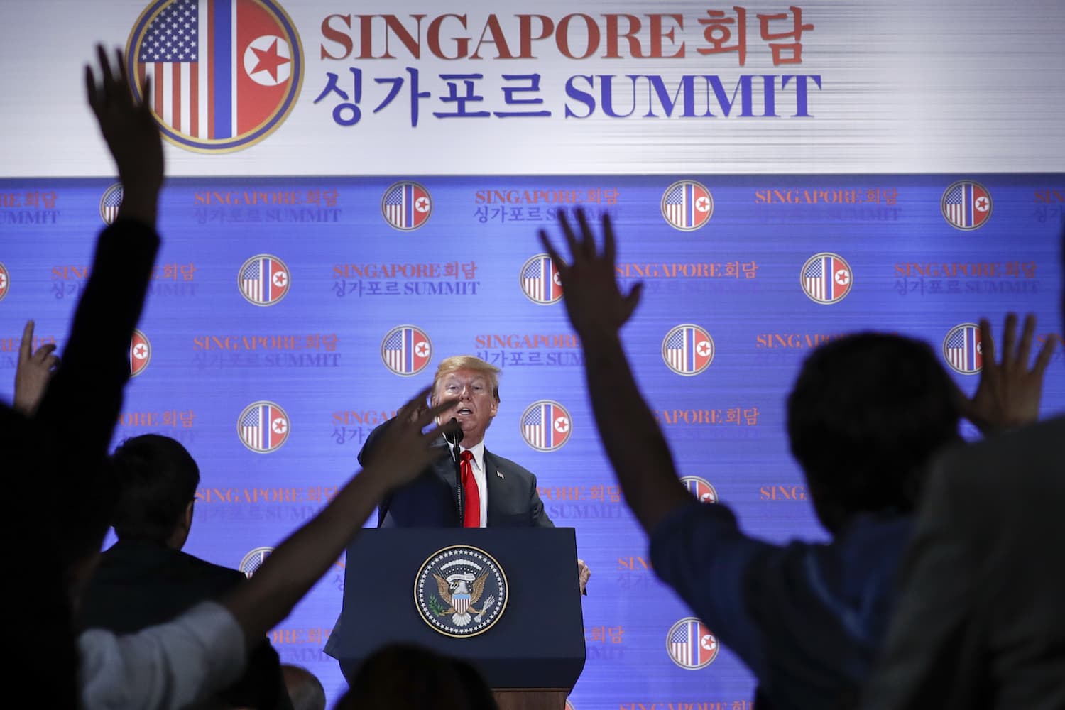 U.S. President Donald Trump answers questions about the summit with North Korea leader Kim Jong Un during a press conference at the Capella resort on Sentosa Island Tuesday, June 12, 2018 in Singapore. (Evan Vucci/AP)