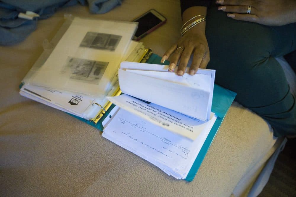 Lisbeth Sandoval keeps records of all of the housing applications she has submitted since relocating from Puerto Rico in January. (Jesse Costa/WBUR)