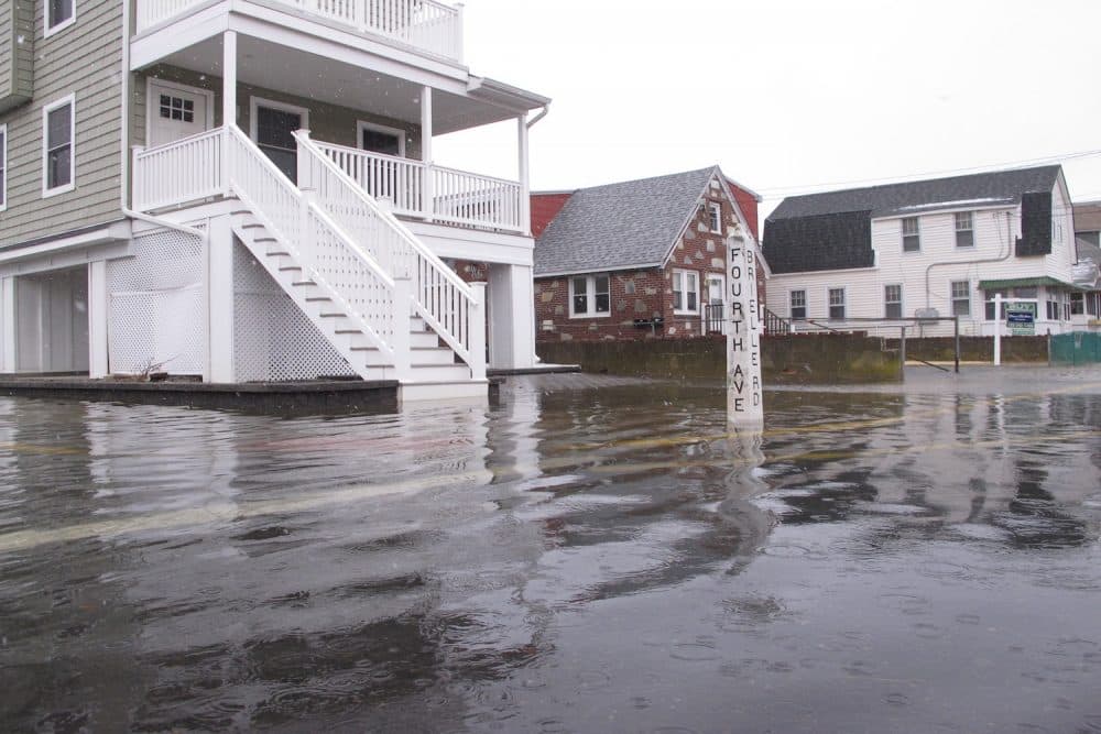 A street near the beach in Manasquan N.J. is covered with flood waters on Wednesday March. 21, 2018, during a coastal storm. (Wayne Parry/AP)