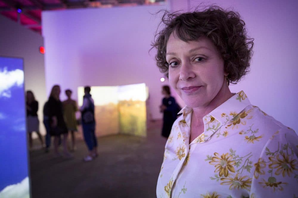 Artist Diana Thater stands in her exhibition at the ICA Watershed. (Robin Lubbock/WBUR)
