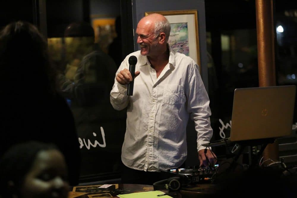 Rob Timmins, aka DJ Rob Suave, plays music during a recent Salsa Sunday at Ryles. (Hadley Green for WBUR)