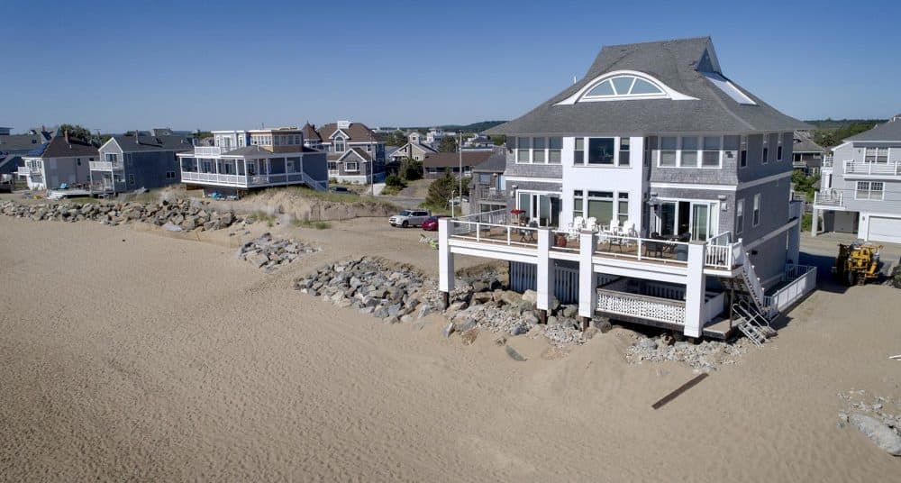 Bob Connors' house stands behind a rock barrier. (Robin Lubbock/WBUR)