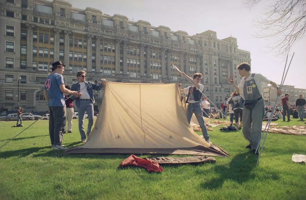 Members of ACT-UP, a group of AIDS activists, erect a tent across the street from Cook County Hospital, April 21, 1990 in Chicago, Ill. (John Swart/AP)