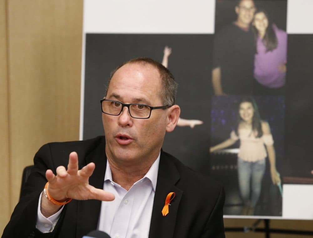 Fred Guttenberg speaks in front of photos of his daughter Jaime, who was killed in the Parkland school shootings, during a news conference on May 24 in Miami. (Wilfredo Lee/AP)