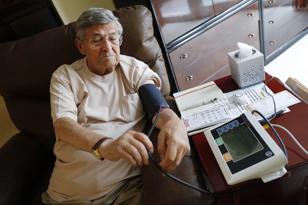 In this May 29, 2018, photo, Sidney Kramer, 92, uses a remote medical monitoring system to check his vital signs at his home in Bethesda, Md. (Pablo Martinez Monsivais/AP)