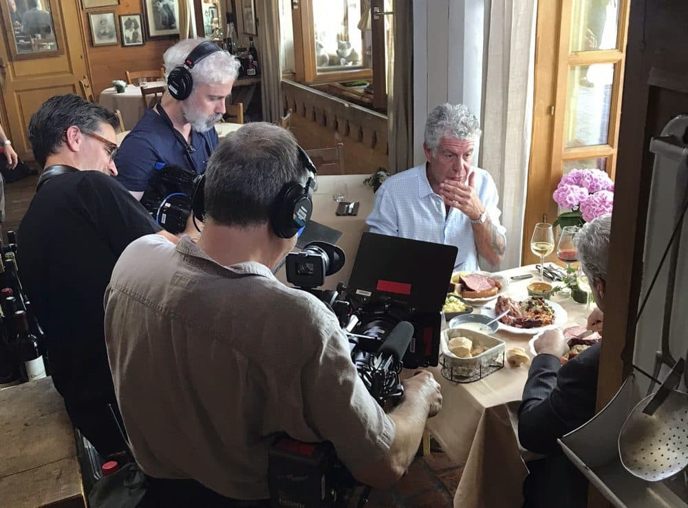 In this photo taken on Monday, June 4, 2018, Anthony Bourdain is seen with a film crew at Wistub de la Petite Venise, a restaurant in Colmar, France. (Etienne Butterlin via AP)