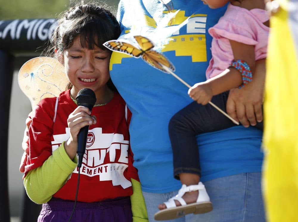 Akemi Vargas, 8, cries as she talks about being separated from her father during an immigration family separation protest in front of the Sandra Day O'Connor U.S. District Court building, Monday, June 18, 2018, in Phoenix. An unapologetic President Donald Trump defended his administration's border-protection policies Monday in the face of rising national outrage over the forced separation of migrant children from their parents. (Ross D. Franklin/AP)