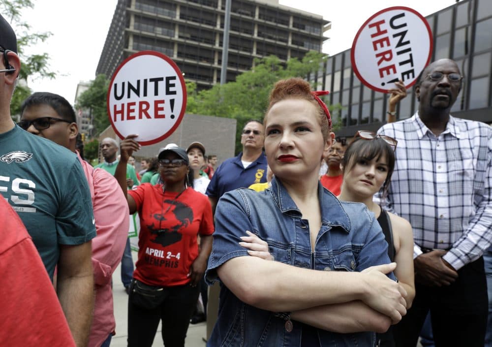 In this Wednesday June 27, 2018 file photo, Amanda Hammock, center, a Delaware County, Pa. Democratic party activist, is dressed as Rosie the Riveter as she attends a protest by Philadelphia Council AFL-CIO in Philadelphia. The protesters denounced Wednesday's U.S. Supreme Court ruling that government workers can't be forced to contribute to labor unions that represent them in collective bargaining, dealing a serious financial blow to organized labor. (Jacqueline Larma/AP)