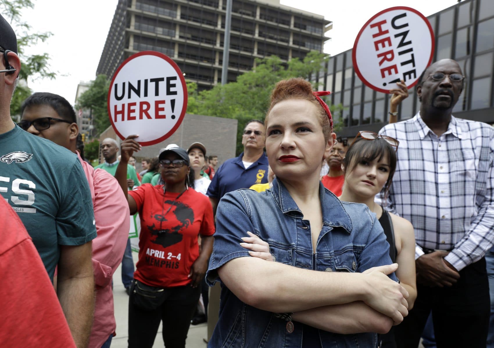 In this Wednesday June 27, 2018 file photo, Amanda Hammock, center, a Delaware County, Pa. Democratic party activist, is dressed as Rosie the Riveter as she attends a protest by Philadelphia Council AFL-CIO in Philadelphia. The protesters denounced Wednesday's U.S. Supreme Court ruling that government workers can't be forced to contribute to labor unions that represent them in collective bargaining, dealing a serious financial blow to organized labor. (Jacqueline Larma/AP)