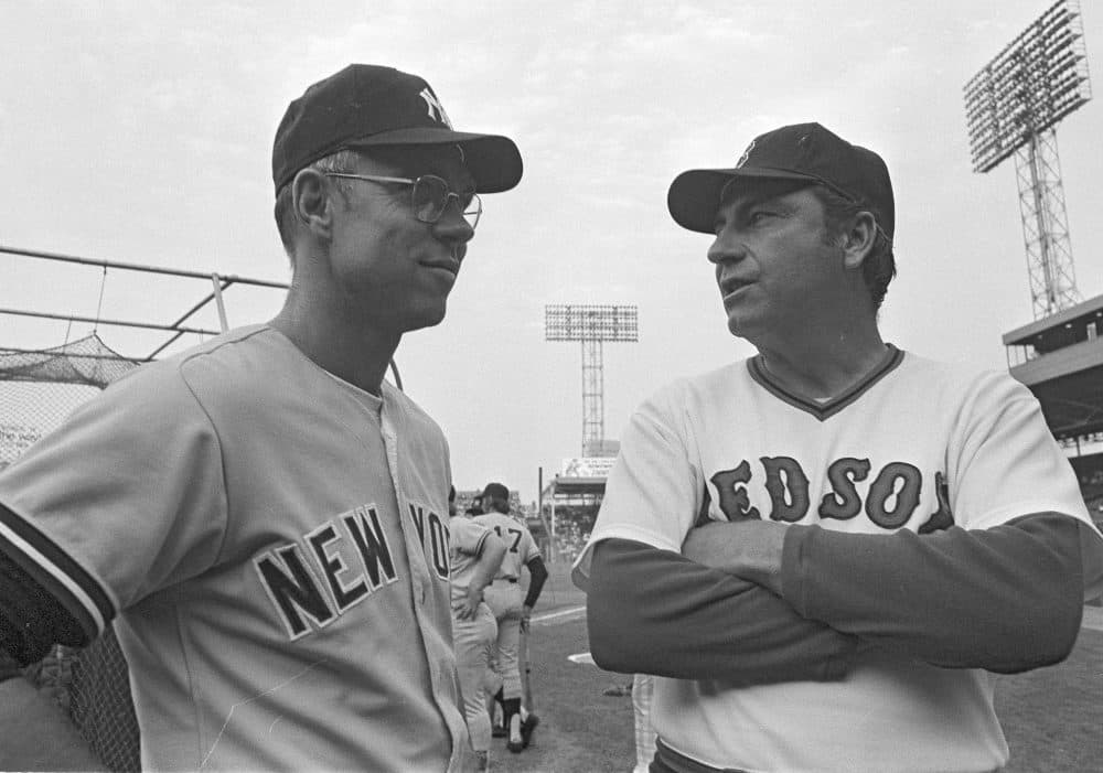 New York Yankees' manager Bill Virdon, left, and Darrell Johnson, manager of the Boston Red Sox, get together before their game in Boston, Sept. 9, 1974. At the time teams were tied for the lead in the American League East. (Frank C. Curtin/AP)