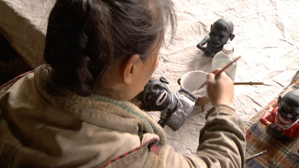 A female worker paints what's called a &quot;jolly n----- bank&quot; in a remote village in China, where many of these racist objects are created. (Courtesy of Chico Colvard)