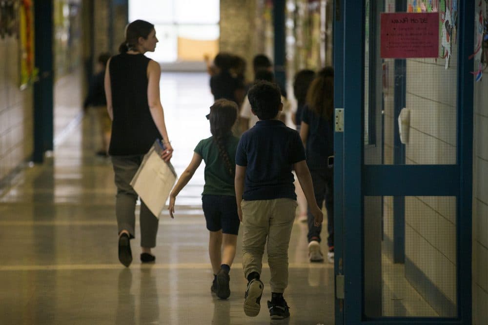 A teacher leads her class through a hallway of Garfield Elementary School. (Jesse Costa/WBUR)