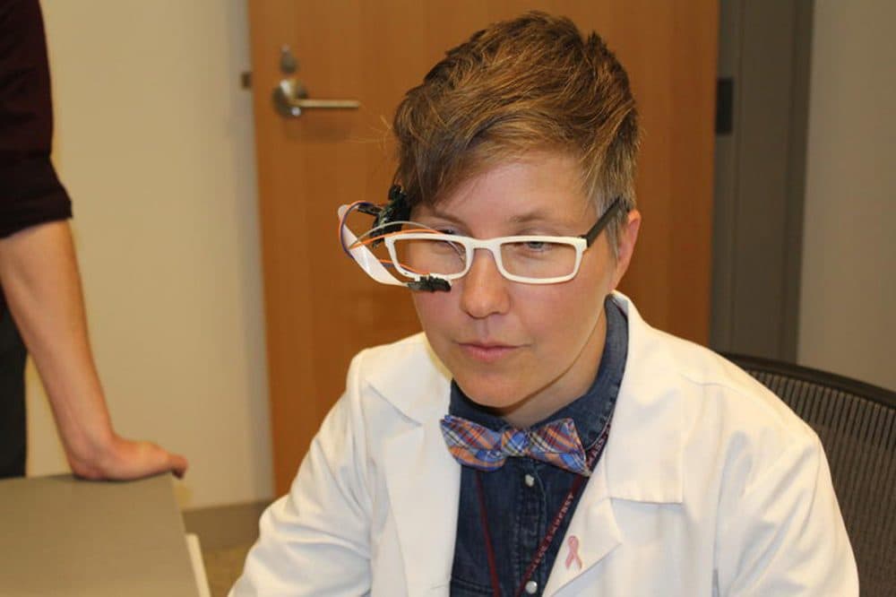 Nurse Rachel Walker demonstrates one of her inventions. (Courtesy Heather Duggan/UMass)