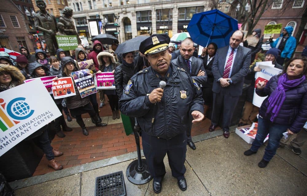 Boston Police Commissioner William Gross speaks to demonstrators during a January 2017 SEIU immigrant rally and reassures them that the Boston police &quot;are not agents of ICE.&quot; (Jesse Costa/WBUR)
